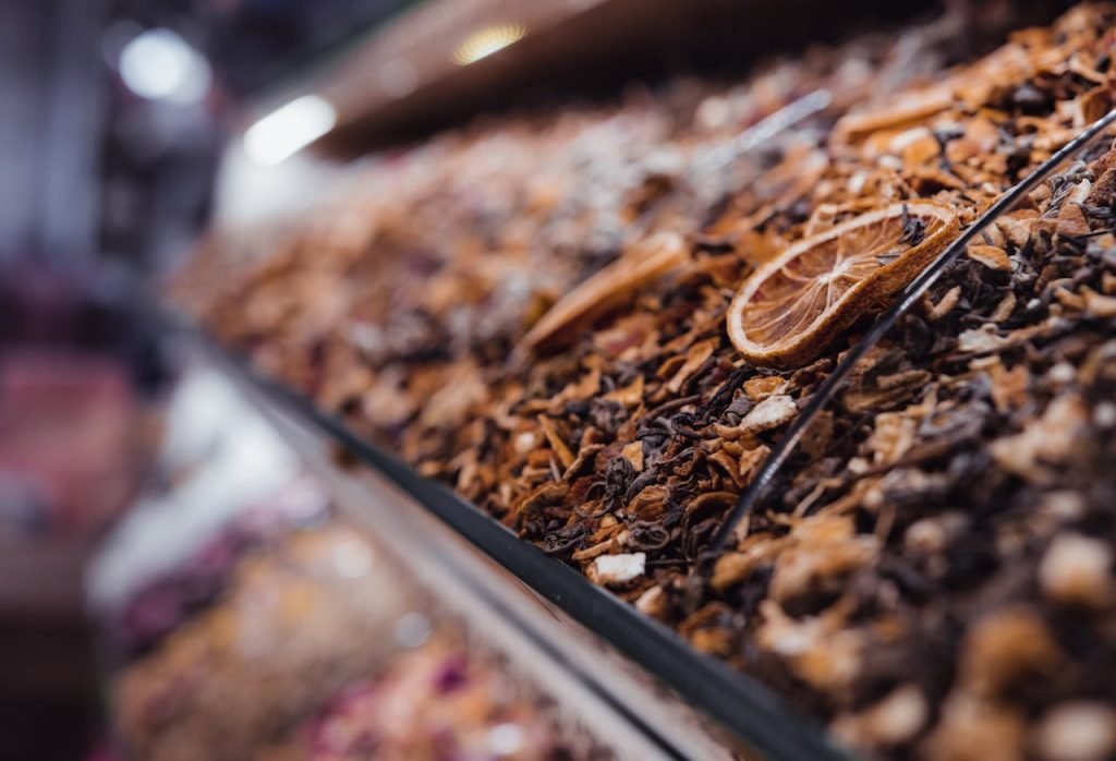Detailed view of dried fruits and spices in a market in Istanbul, showcasing rich textures.